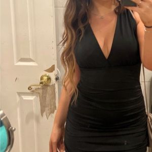 Black low cut dress size medium (Sizes 6-8)